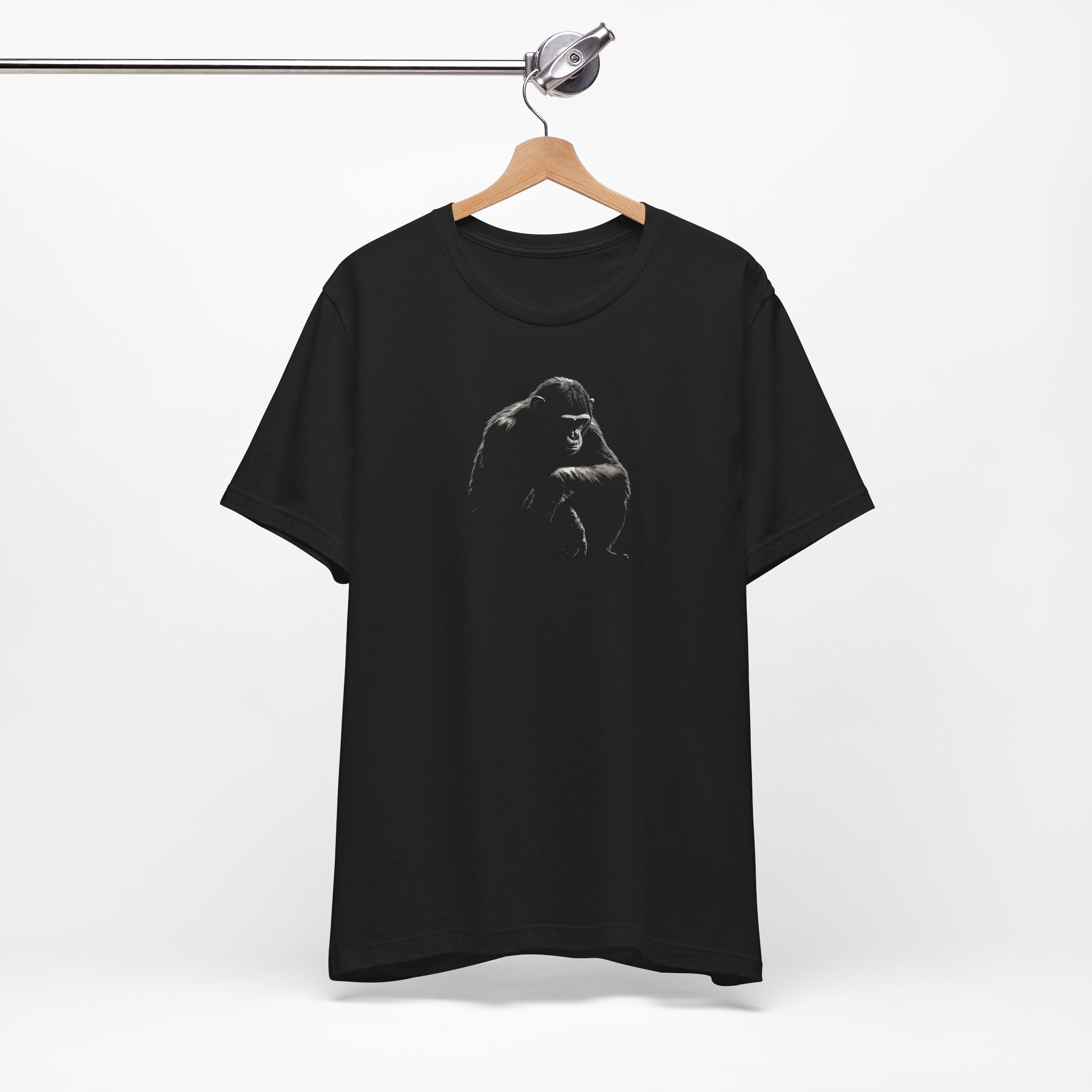 Black cotton t-shirt with a bold monochrome illustration of a gorilla in a kneeling position on the front.