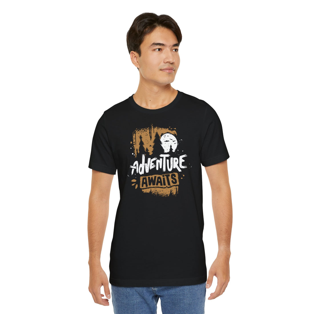 Man wearing a black t-shirt with 'Adventure Awaits' graphic on a white background