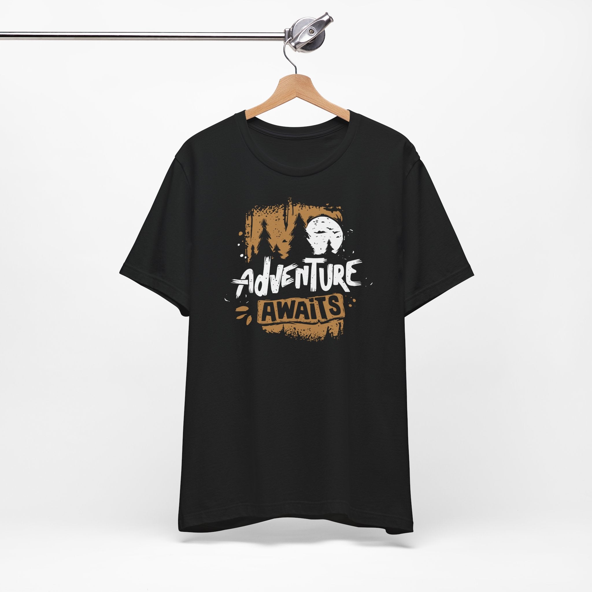 Black t-shirt with 'Adventure Awaits' text on a hanger against a white background