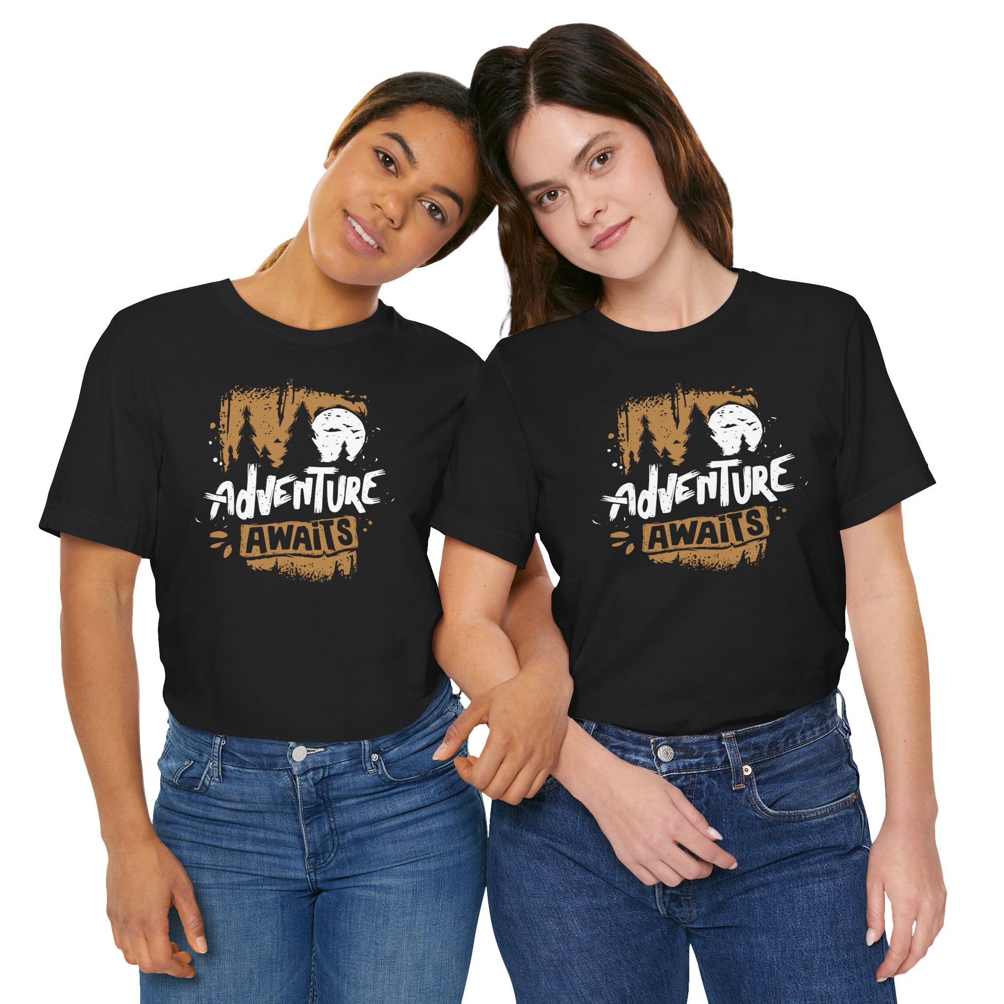 Two people wearing black t-shirts with 'Adventure Awaits' design on a white background