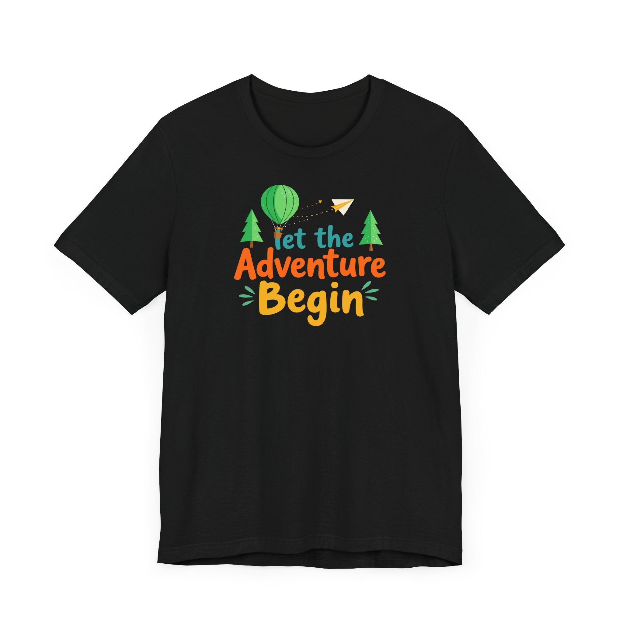 A black crew neck t-shirt with the phrase 'Let the Adventure Begin' printed in a colorful font, accompanied by images of a hot air balloon, trees, and a paper plane.