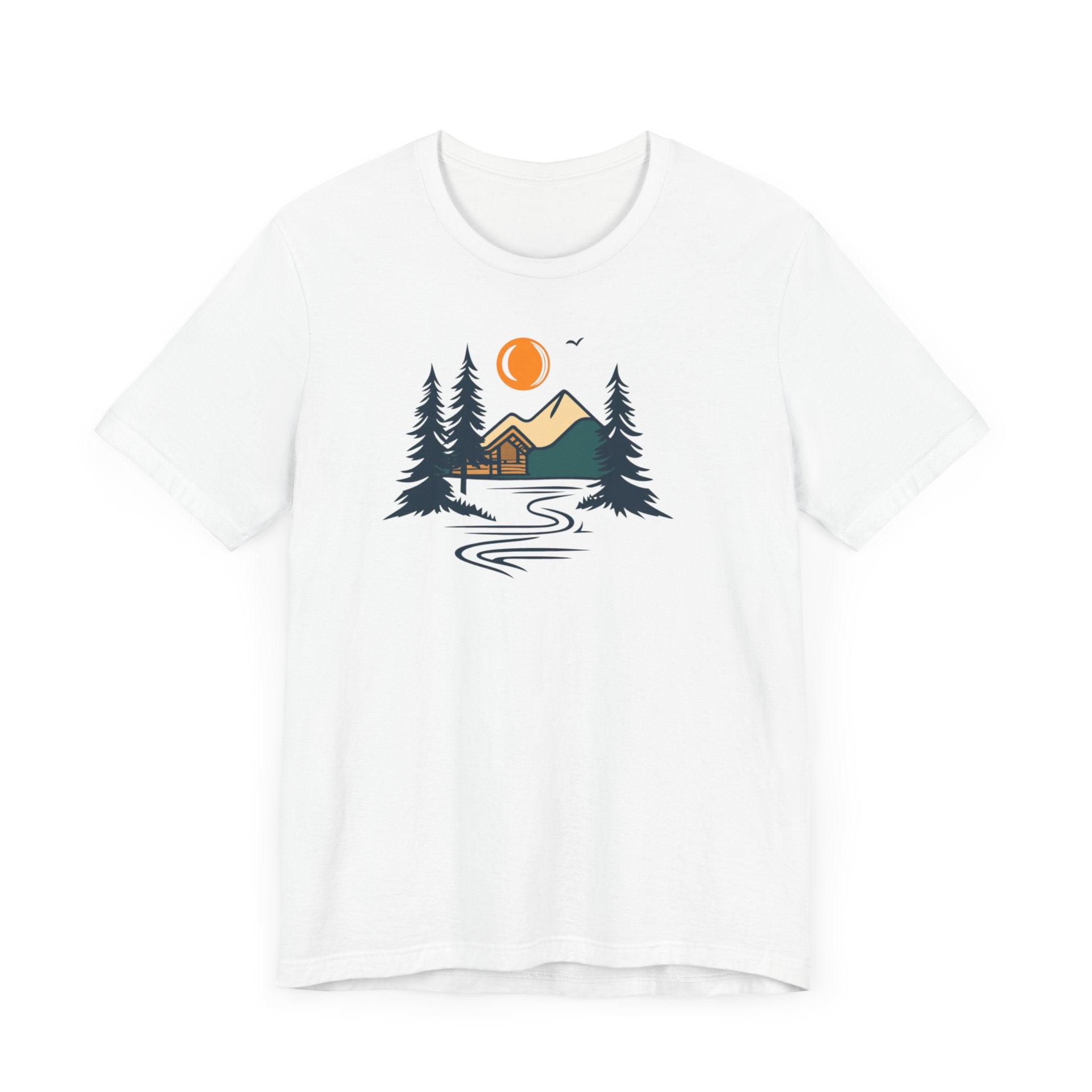 A white cotton t-shirt with a graphic design featuring a cabin, trees, and a mountain range with a warm orange sun.