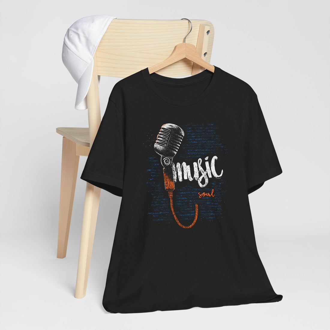 Black t-shirt with microphone graphic and 'music soul' text on a white background