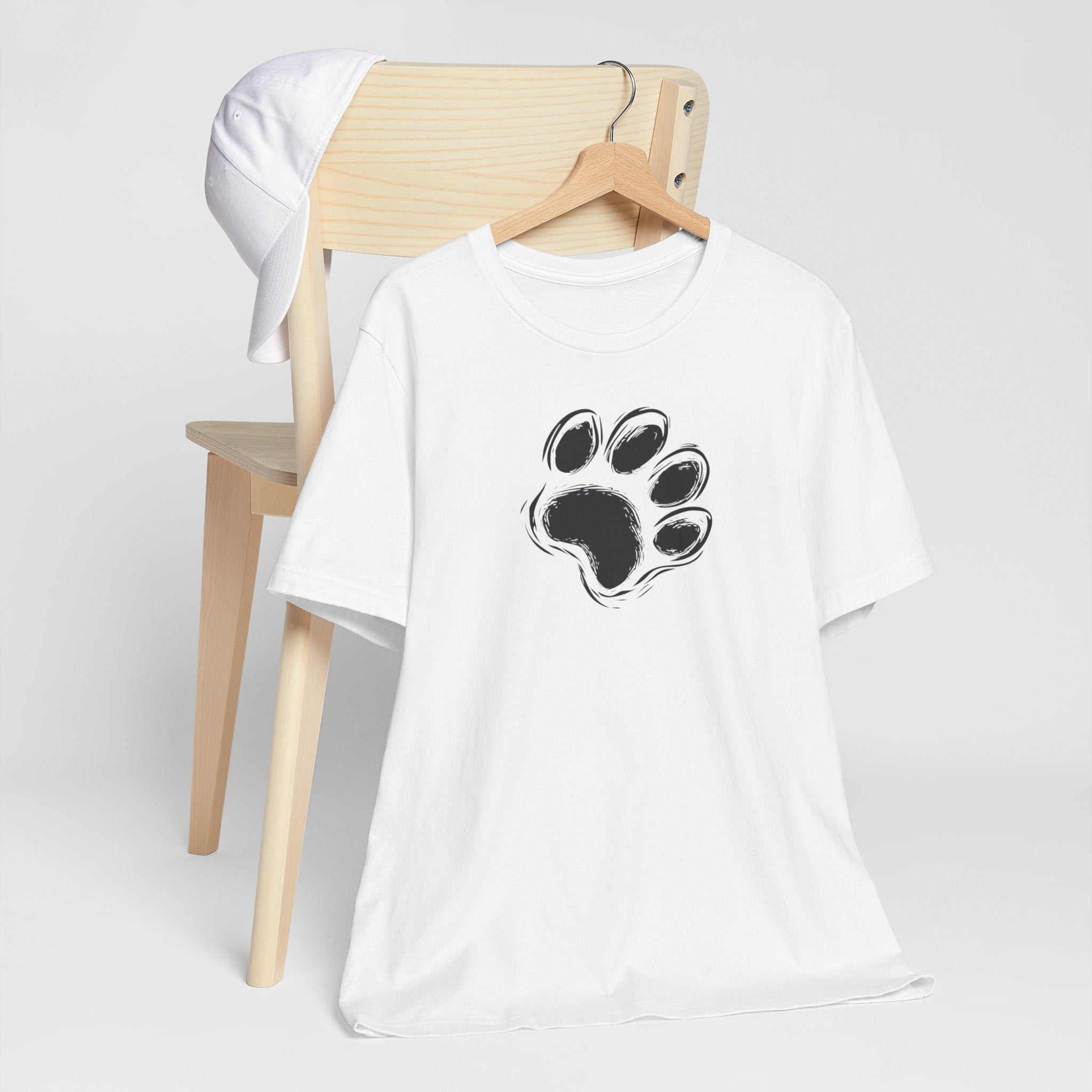 White t-shirt with black paw print minimalist design