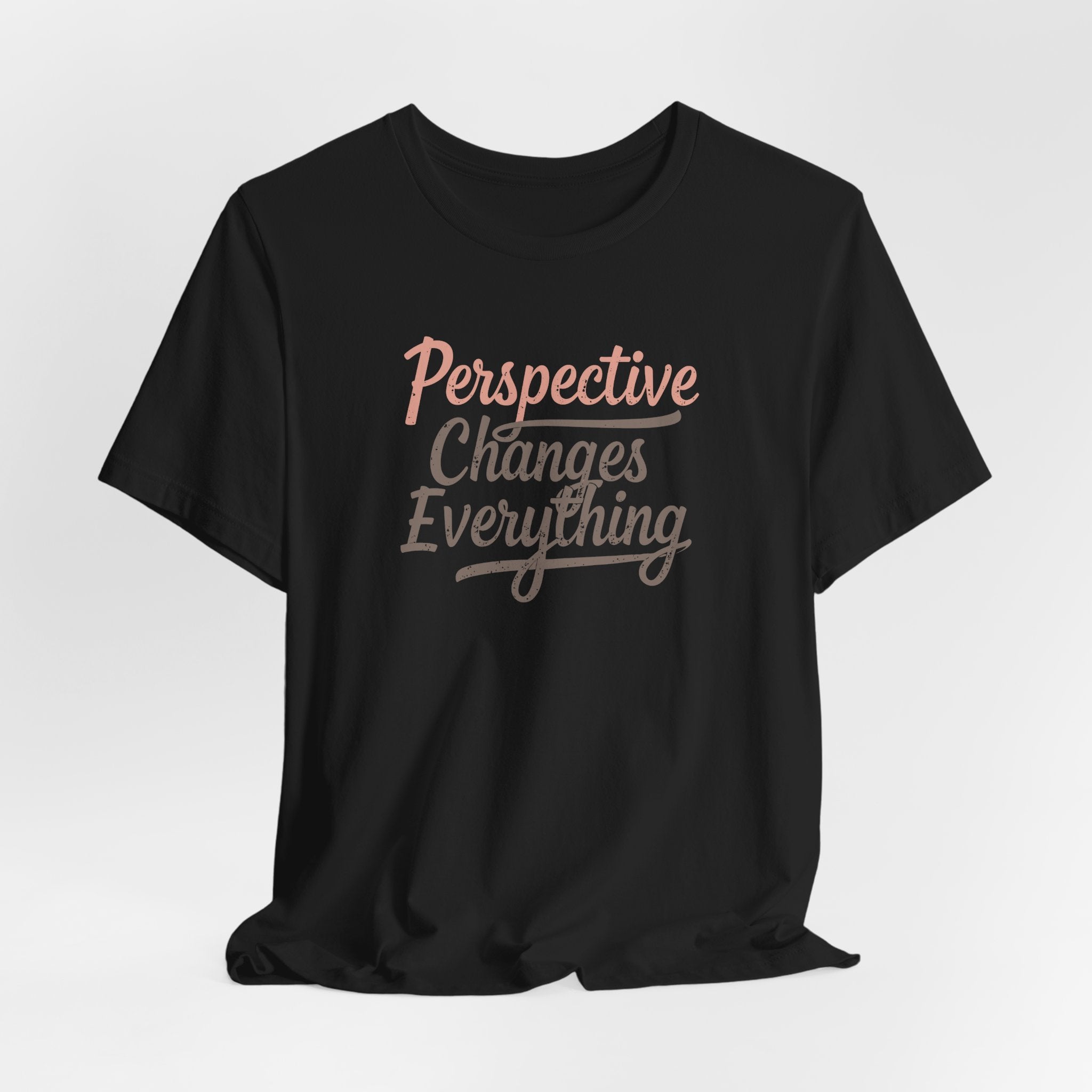 Front view of black “Perspective Changes Everything” T-shirt with motivational quote, unisex fit