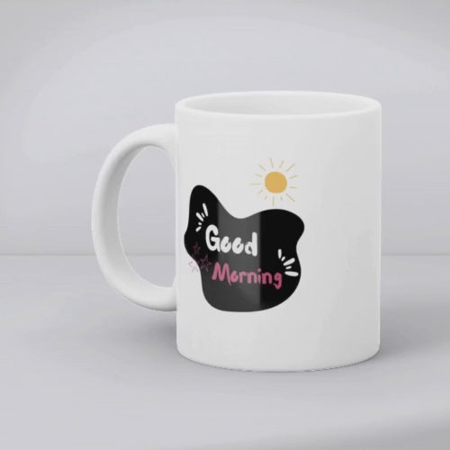 Two ceramic mugs side by side, one with the phrase 'I'm a Rockstar' and stars, the other with 'Good Morning' and a sun graphic, both in black, white, pink, and yellow.