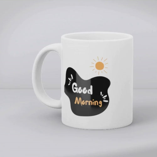 Two white ceramic mugs, one with a hand-drawn smiley face design and the other with a 'Good Morning' message and a sun illustration.