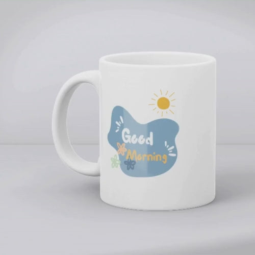 A set of two ceramic mugs, one with a 'Good Morning' message and floral design, and the other featuring a blue flower illustration.