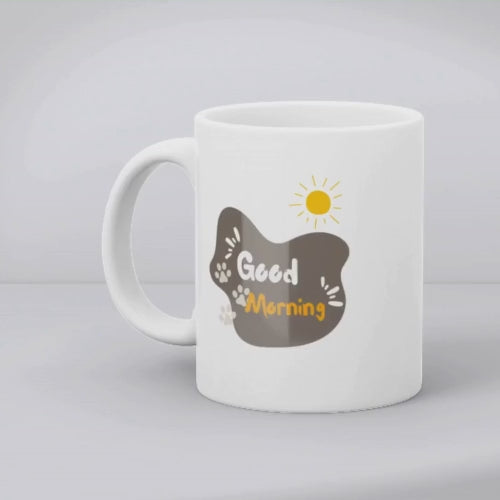 A set of two ceramic mugs, one with a 'Good Morning' text and paw prints, and the other with a series of four cat illustrations.