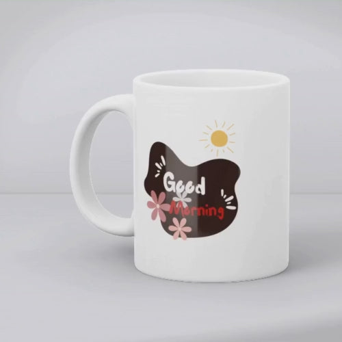 A set of two ceramic mugs, one with a 'Good Morning' text and floral design in blue, and the other with a red floral design.