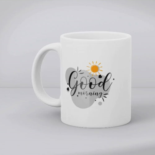 A set of two ceramic mugs, one with a black paw print design on a white background and the other with a 'Good Morning' message alongside a sun and paw accent on a blue background.