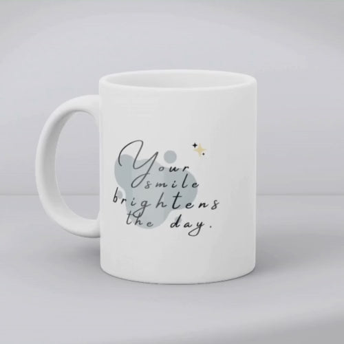 Ceramic coffee cup with “Your Smile Brightens the Day” text