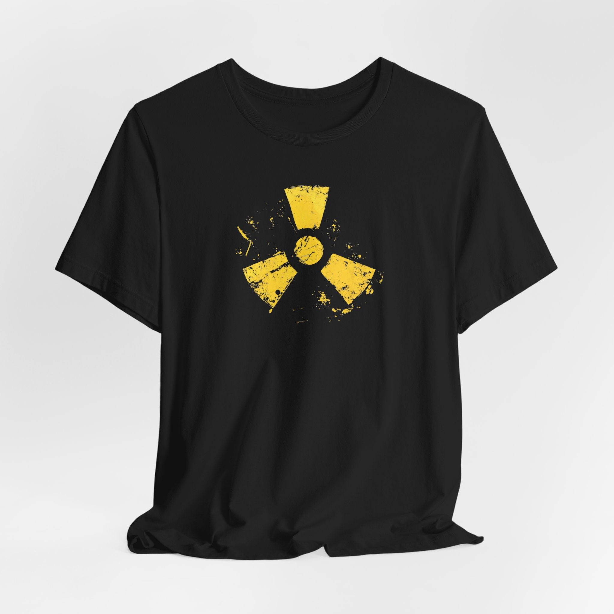A black cotton tee with a grunge yellow hazard design of a radiation symbol on the front.