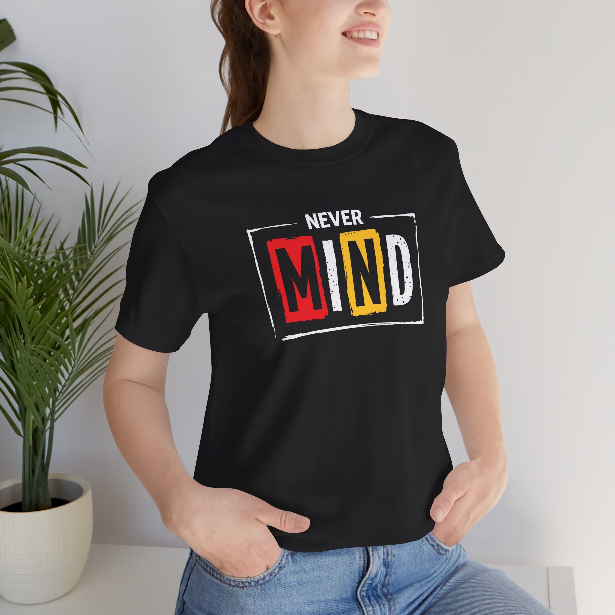 Black streetwear t-shirt with “Never Mind” typography graphic