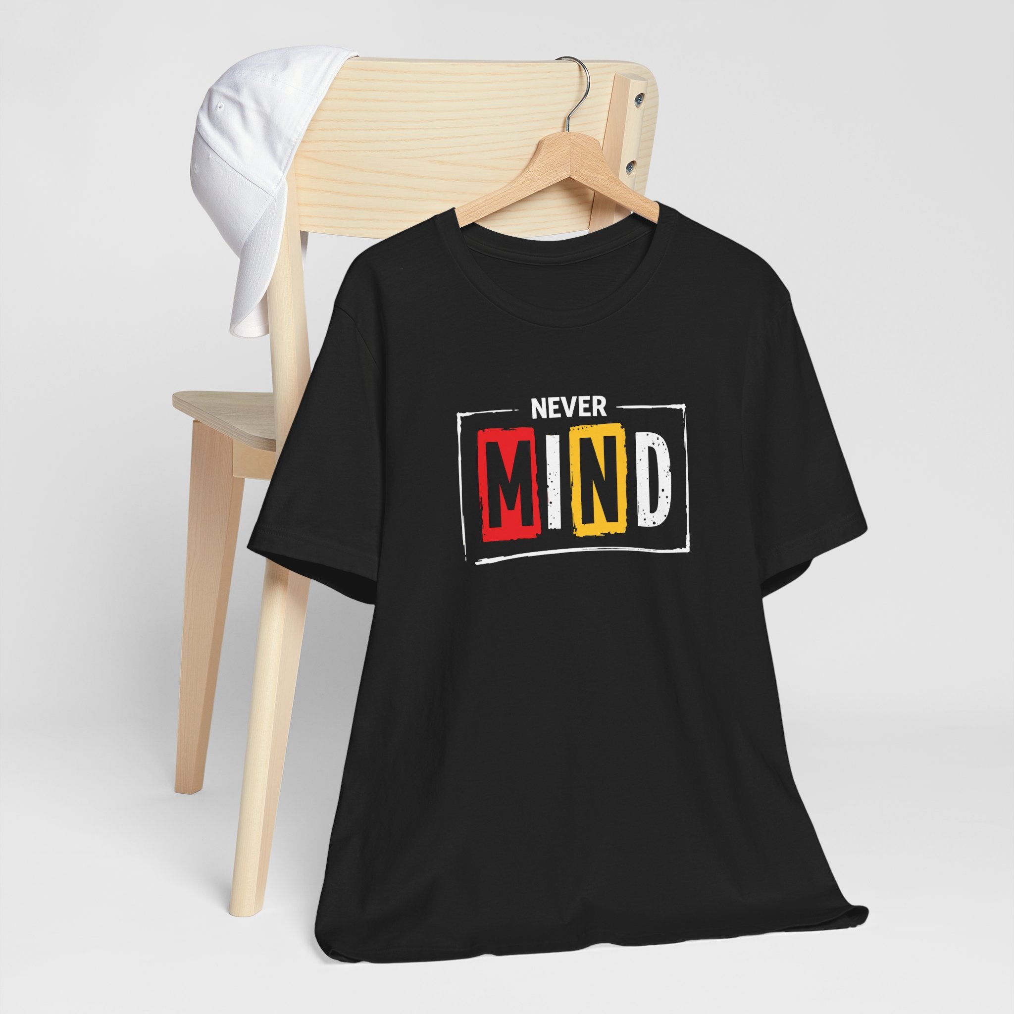 Black streetwear t-shirt with “Never Mind” typography graphic
