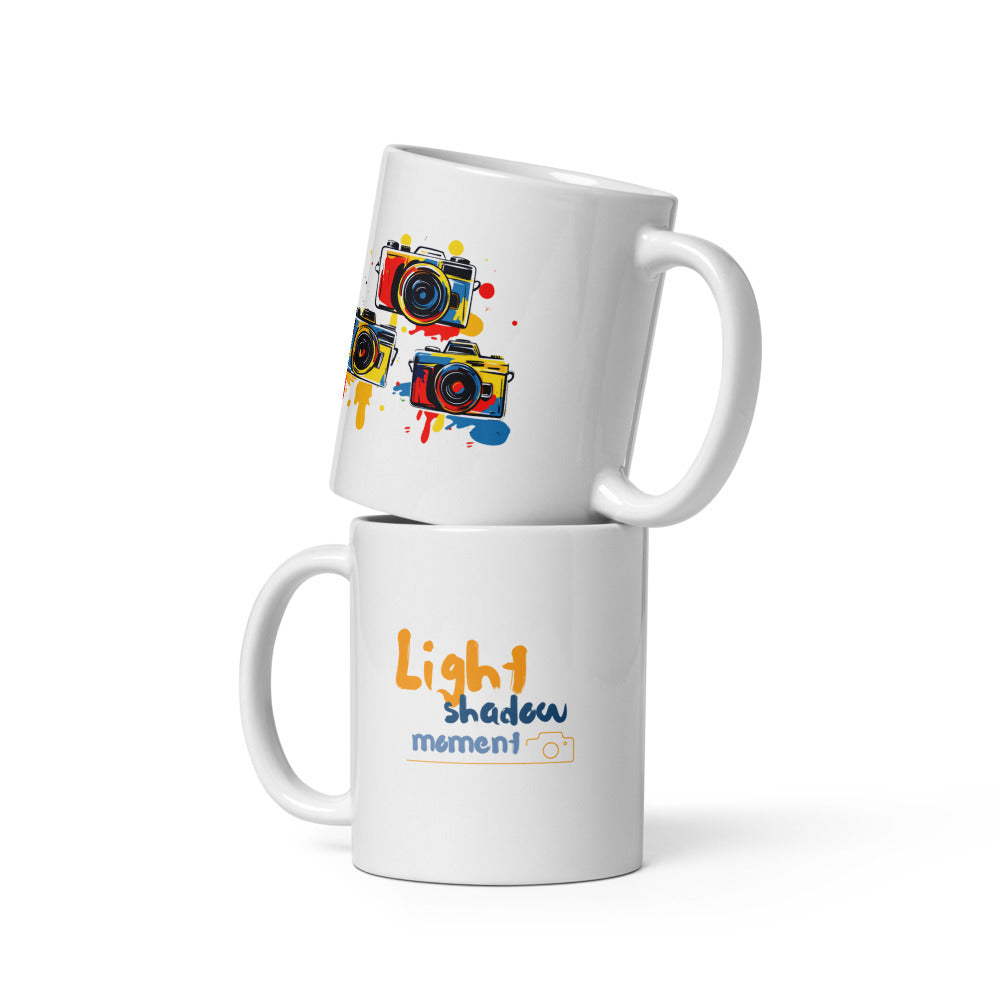 Colorful artistic camera mug with 'Light shadow moment' quote, a vibrant 11oz coffee cup gift for photographers and artists.