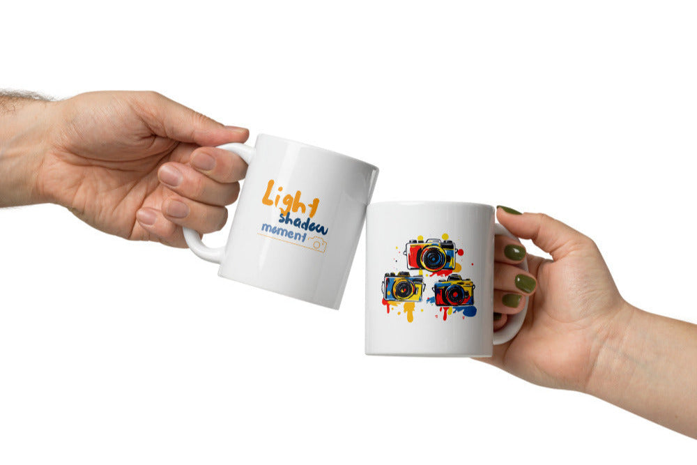 Colorful artistic camera mug with 'Light shadow moment' quote, a vibrant 11oz coffee cup gift for photographers and artists.