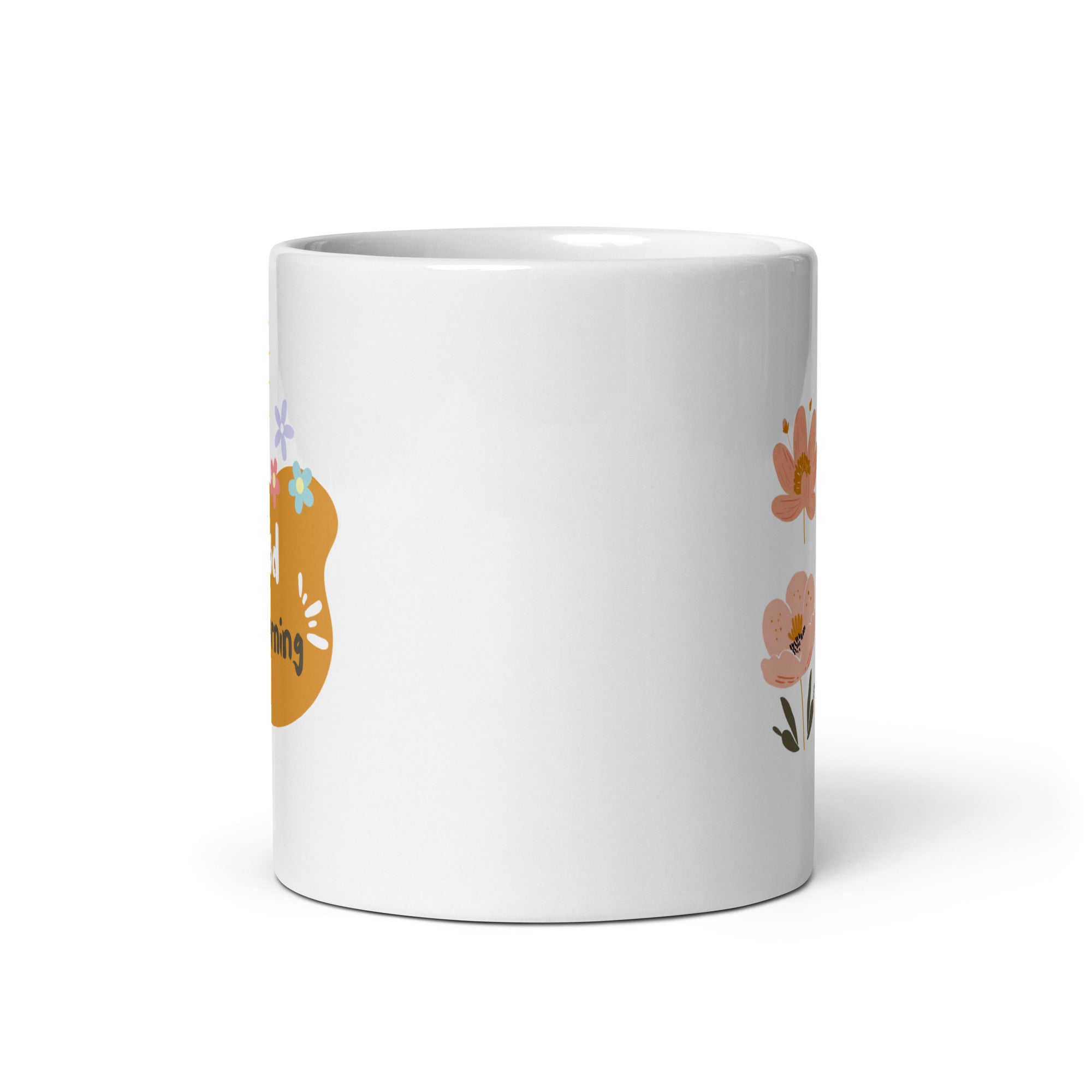 A set of two ceramic mugs, one with a floral design featuring various flowers in earthy tones and the other with a 'Good Morning' message in a golden background. Both mugs have handles and are shown with the inside of one mug facing the viewer.