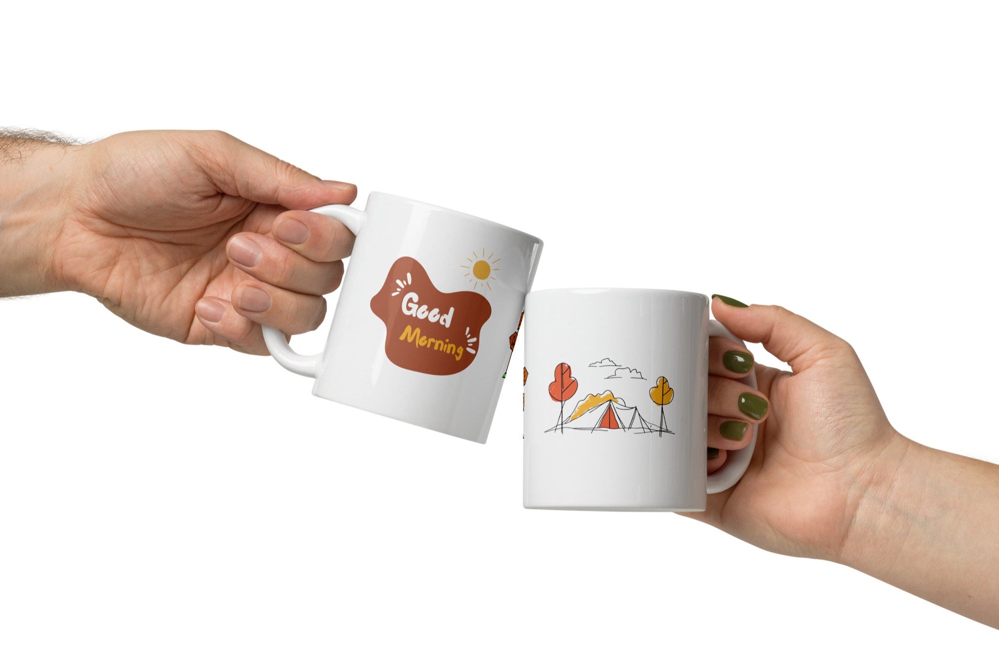 Two ceramic mugs, one with a camping tent and sun design and the other with a 'Good Morning' text and sun design, both in white with colorful illustrations.