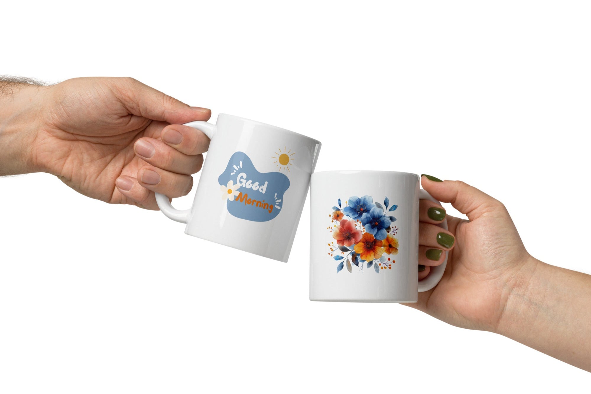 Two ceramic mugs, one with a 'Good Morning' message and a sun design, and the other featuring a floral arrangement of blue and orange flowers.