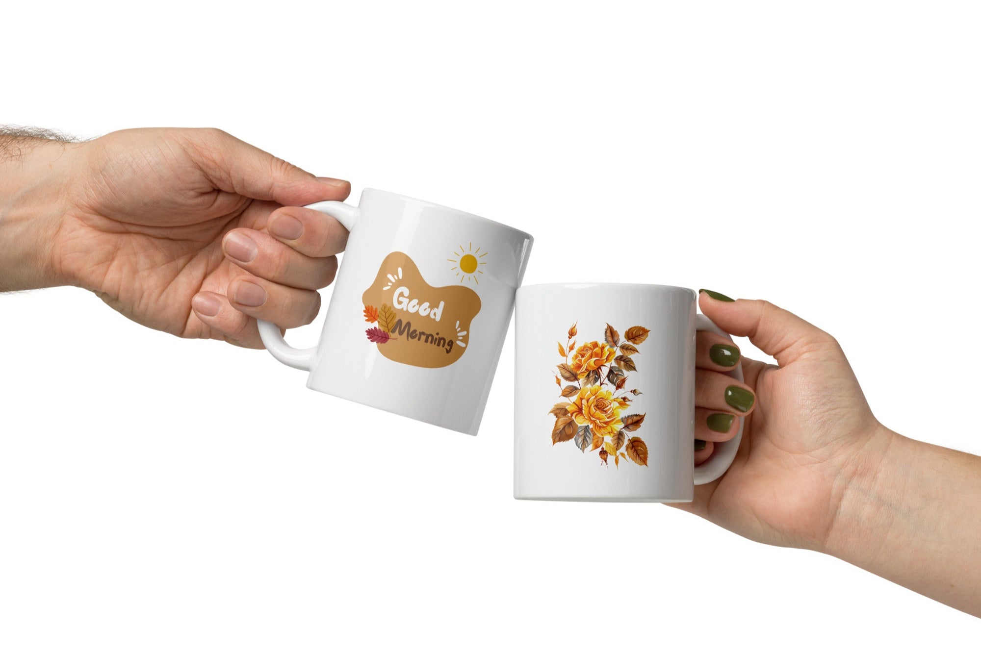 A set of two ceramic mugs, one with a floral design of golden roses and autumn leaves, and the other with a sun and leaves pattern, both with 'Good Morning' and 'Good Afternoon' text respectively.