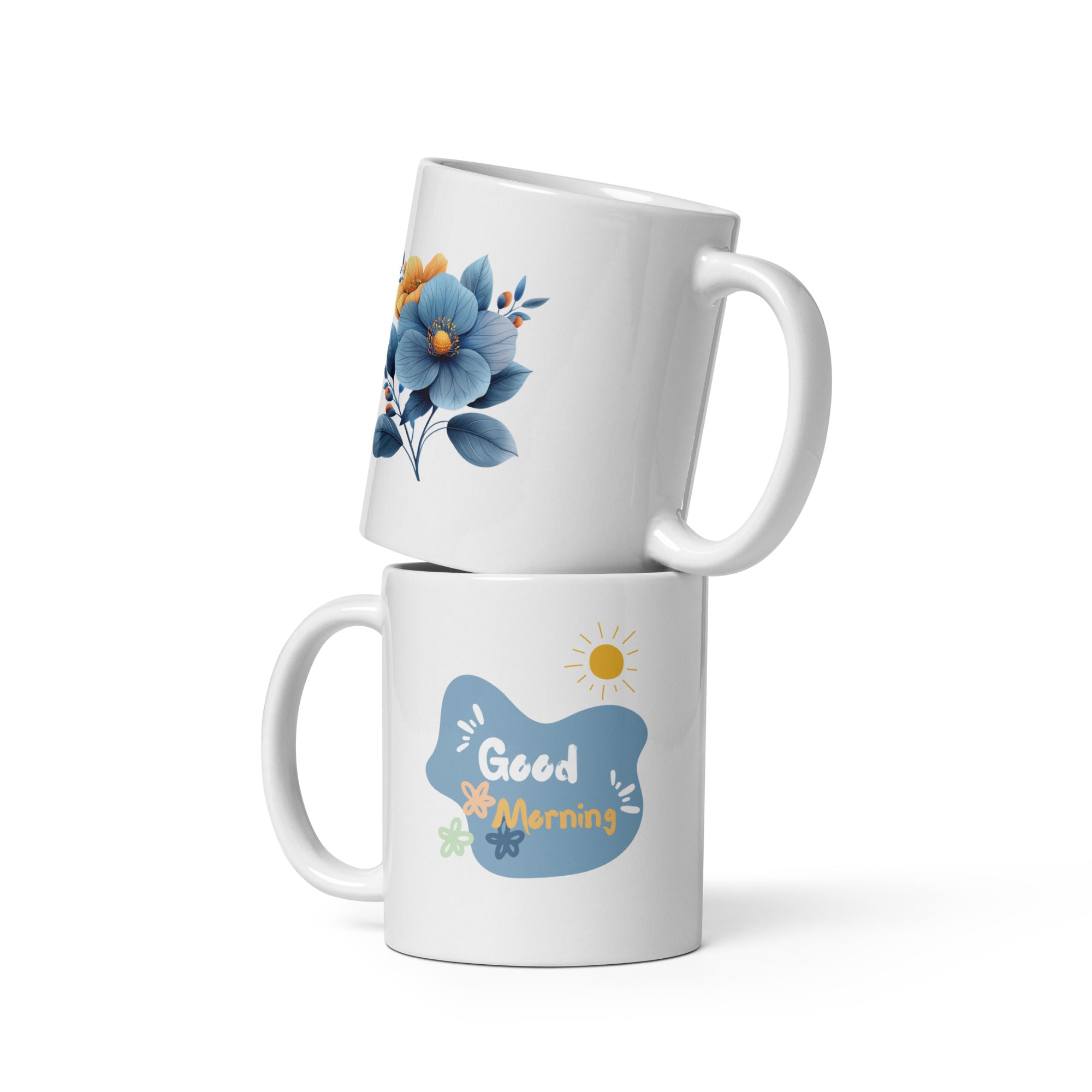 A set of two ceramic mugs, one with a 'Good Morning' message and floral design, and the other featuring a blue flower illustration.