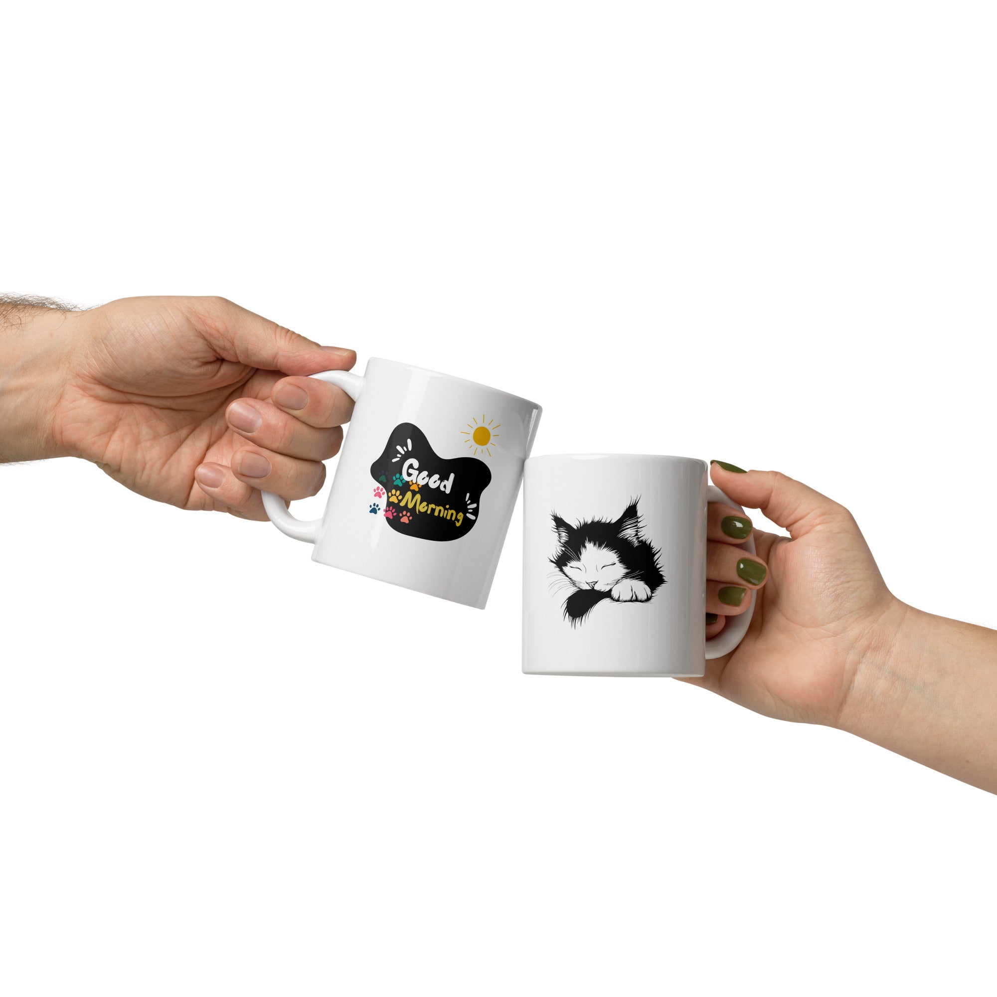 Two ceramic mugs, one with a 'Good Morning' design featuring paw prints and a sun, and the other with a black and white sleeping kitten design.