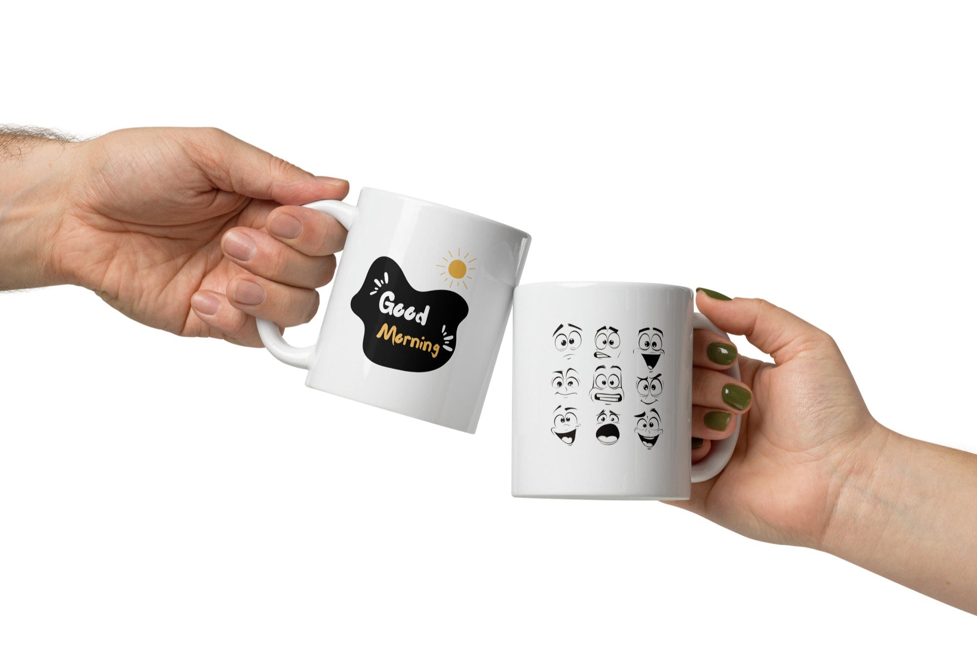 A set of two ceramic mugs, one with various playful cartoon faces and the other with a 'Good Morning' message accompanied by a sun illustration.