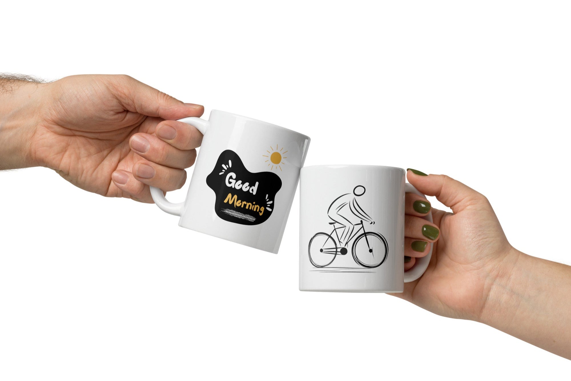 Two white ceramic mugs, one with a minimalist black bicycle design and the other featuring a 'Good Morning' message with a yellow sun accent, both with bold black and yellow prints.