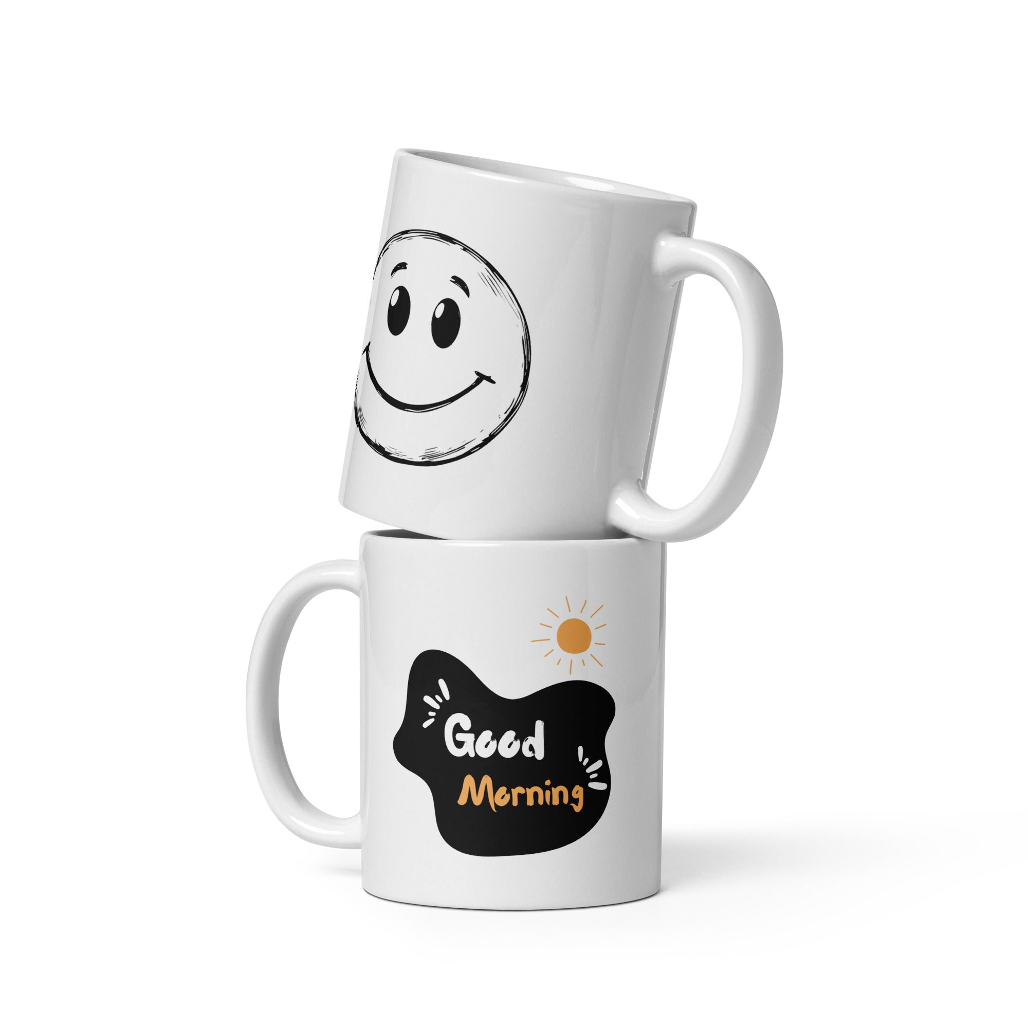 Two white ceramic mugs, one with a hand-drawn smiley face design and the other with a 'Good Morning' message and a sun illustration.