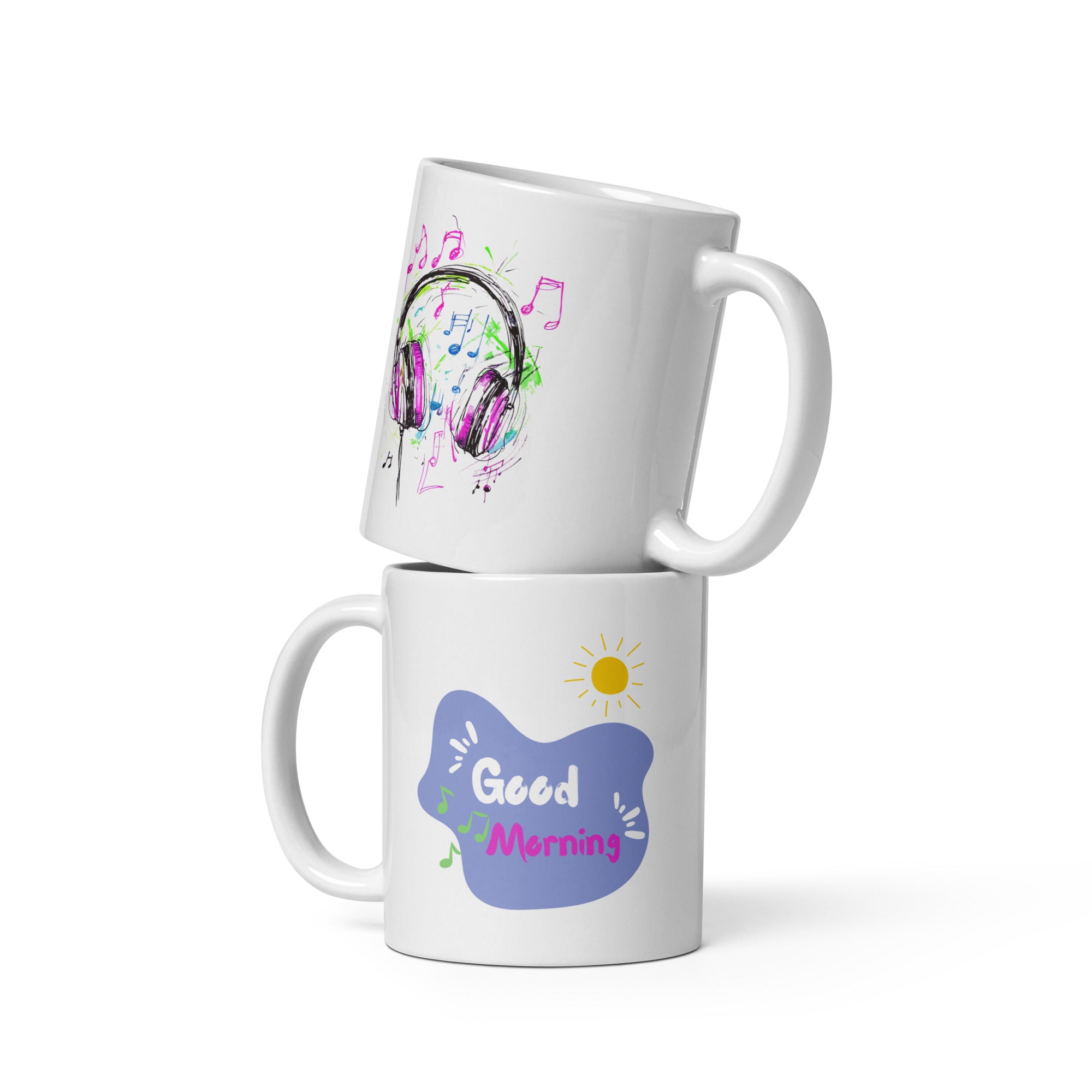Two ceramic mugs side by side; one with a colorful sketch of headphones and musical notes, and the other with a 'Good Morning' message and a sun icon.