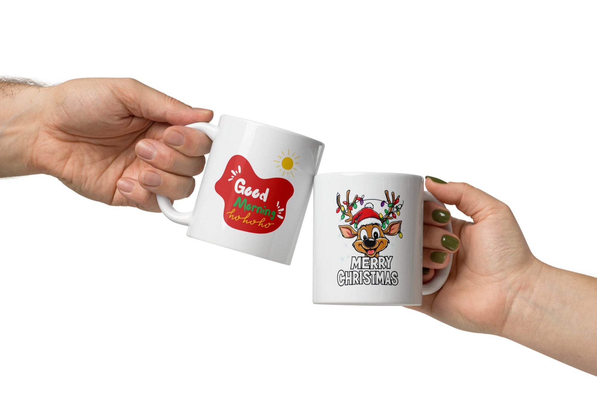 Two ceramic coffee mugs with festive Christmas designs. One mug has a reindeer with a Santa hat and 'Merry Christmas' text, and the other mug has a sun with 'Good Morning Ho Ho Ho' text.
