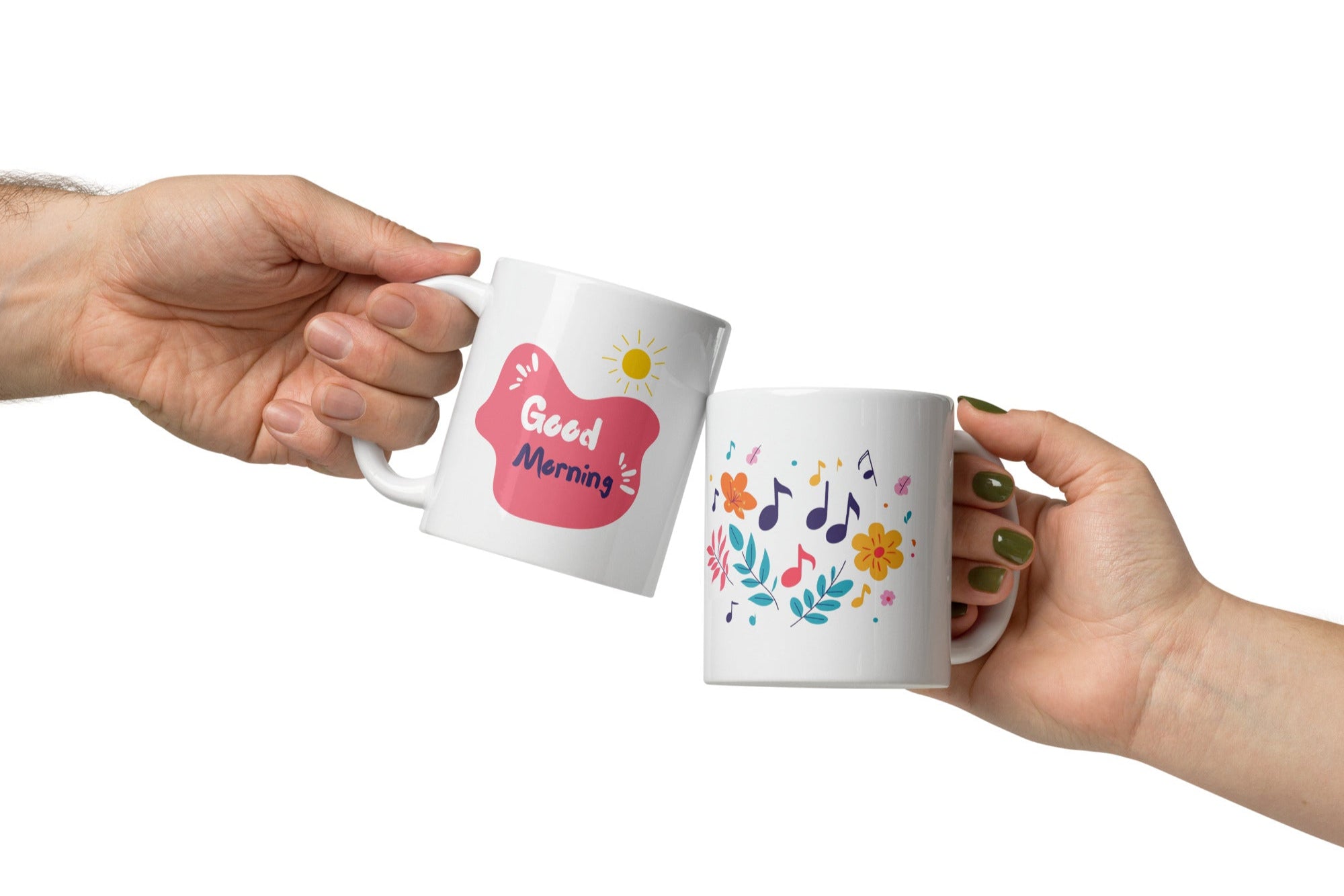 Two ceramic coffee mugs with floral and music notes designs, one with a 'Good Morning' message and the other with a sun and clouds design.