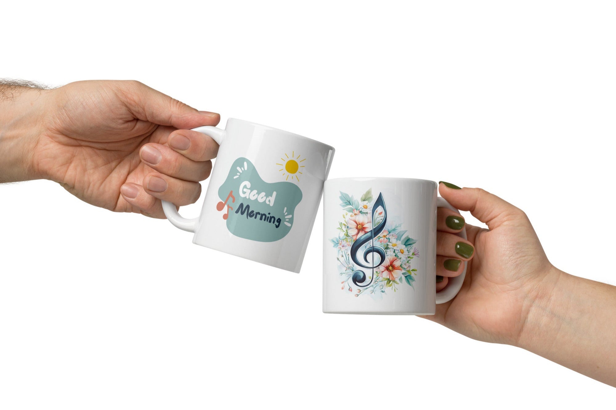 Two ceramic coffee mugs with floral and musical designs. One mug has a floral treble clef design with the text 'Good Morning' and musical notes, while the other has a simple 'Good' design with a sun motif.
