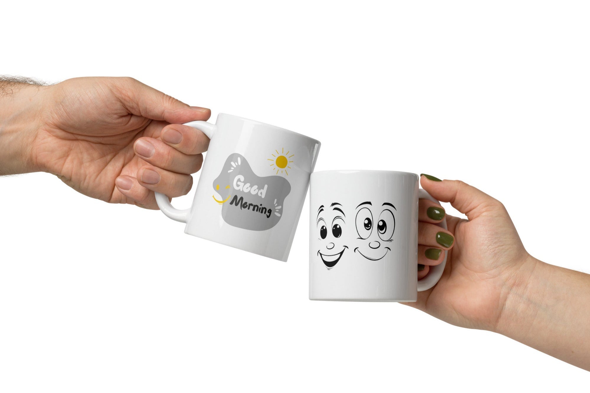 Two ceramic coffee mugs, one with a smiling face design and 'Good Morning' text, the other with a sun and 'Good Afternoon' text. Both have a white background with decorative elements.