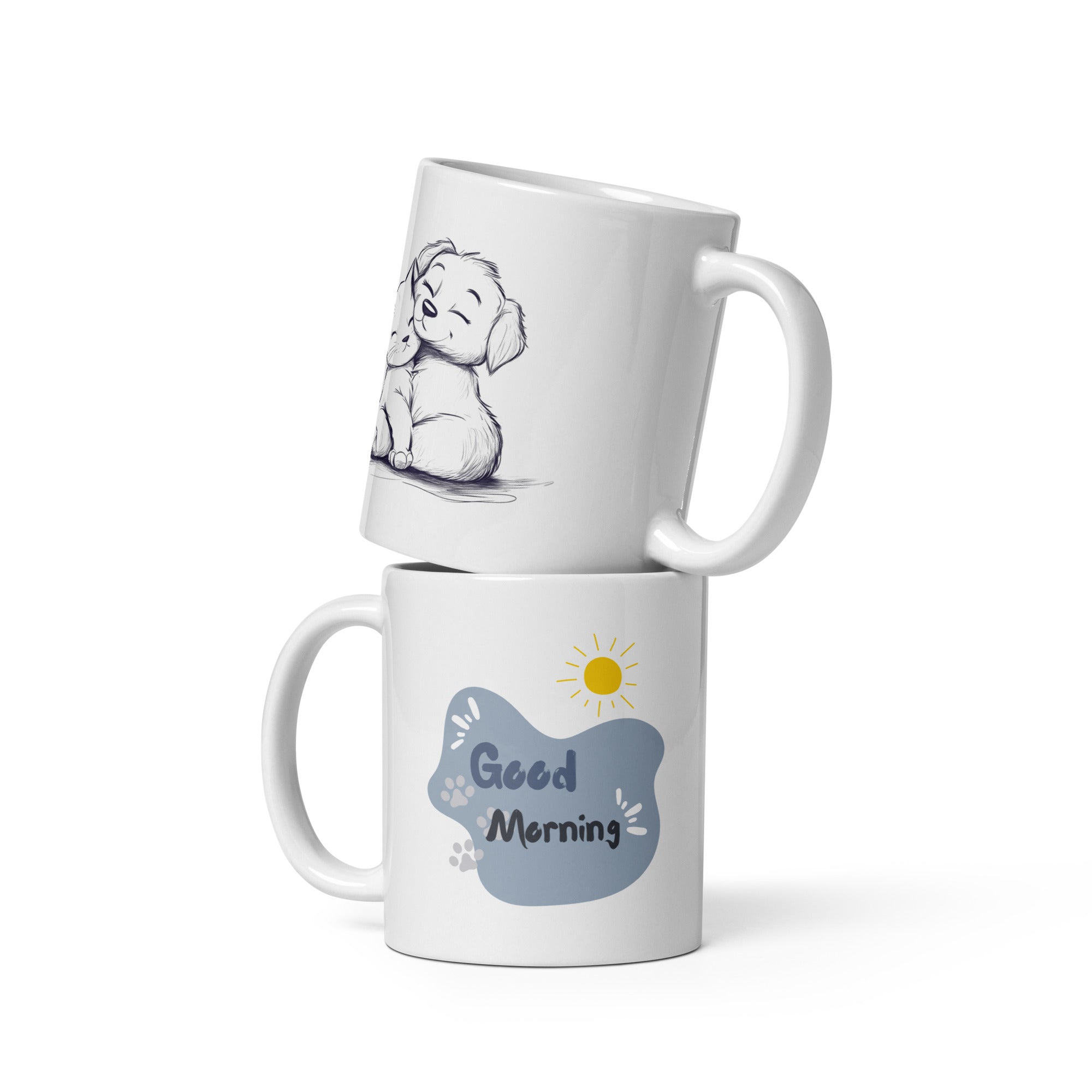 A ceramic coffee mug with a double-sided design featuring an illustration of a puppy and a kitten on one side and a 'Good Morning' message with paw prints on the other.