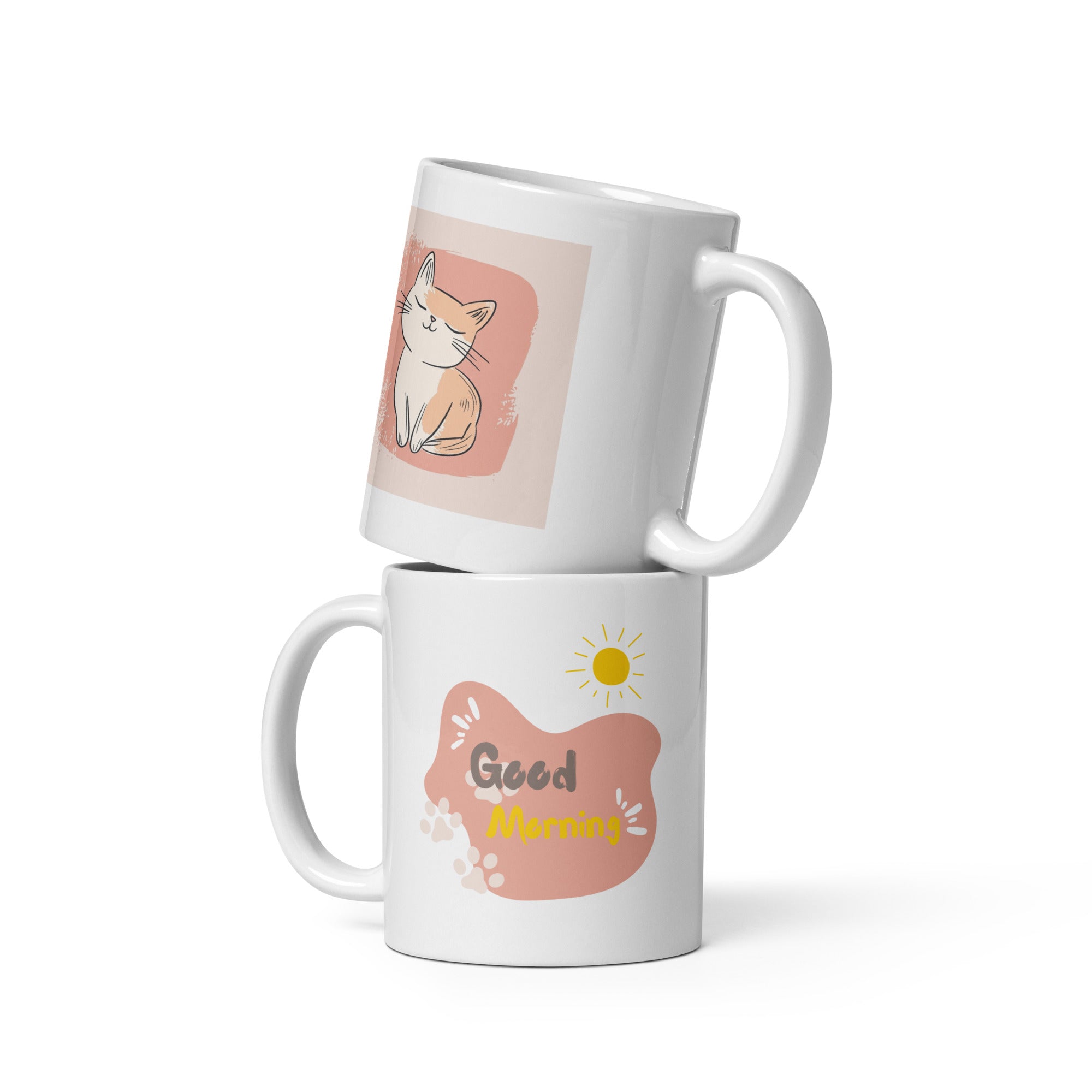 A set of ceramic coffee mugs with double-sided prints. One mug features a minimalist illustration of a cat on a beige background with a 'Good Morning' message and paw prints.