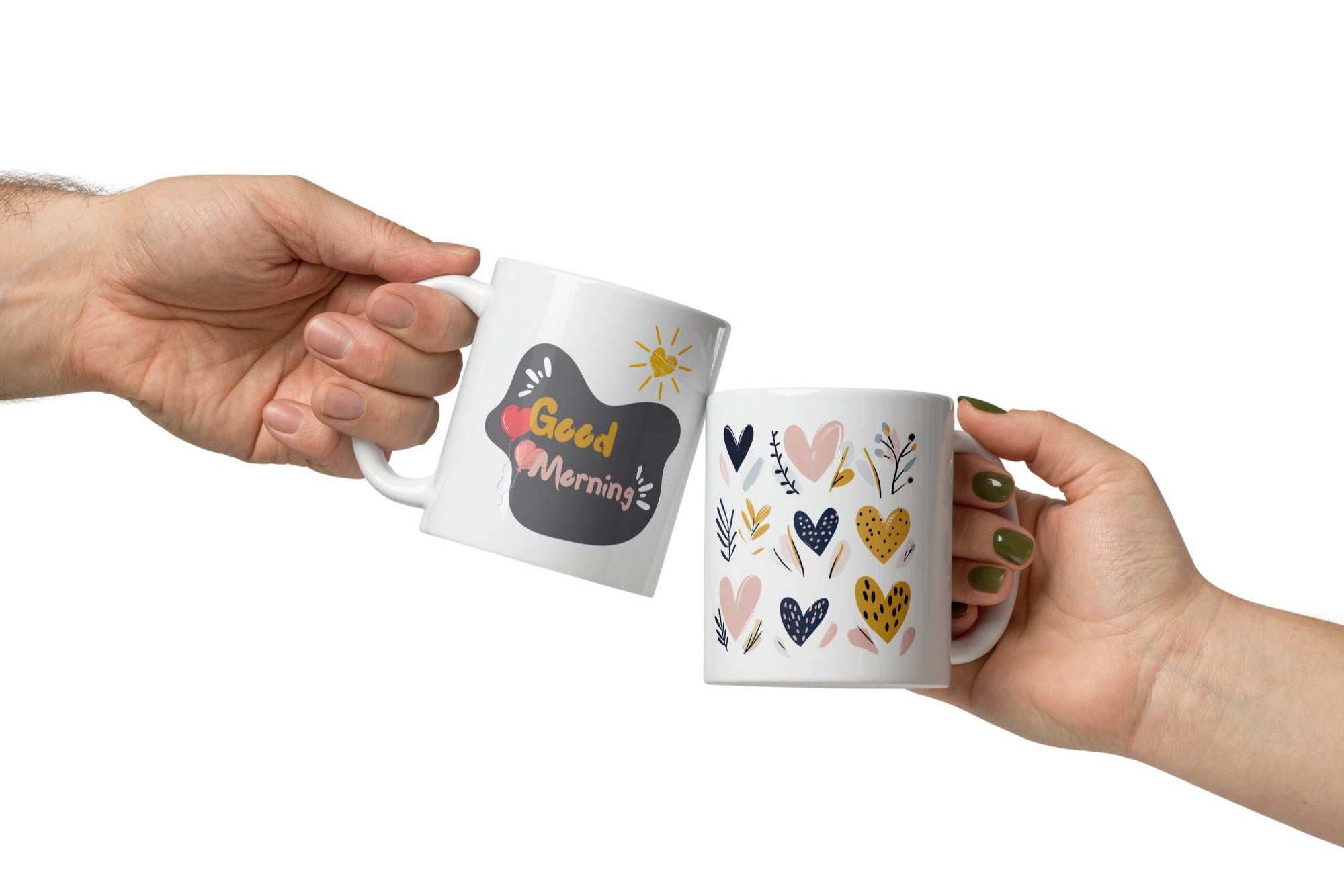 Two ceramic coffee mugs with heart and balloon patterns, one with a 'Good Morning' message and the other with a 'Good Night' message.