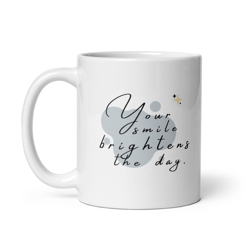 Ceramic coffee cup with “Your Smile Brightens the Day” text