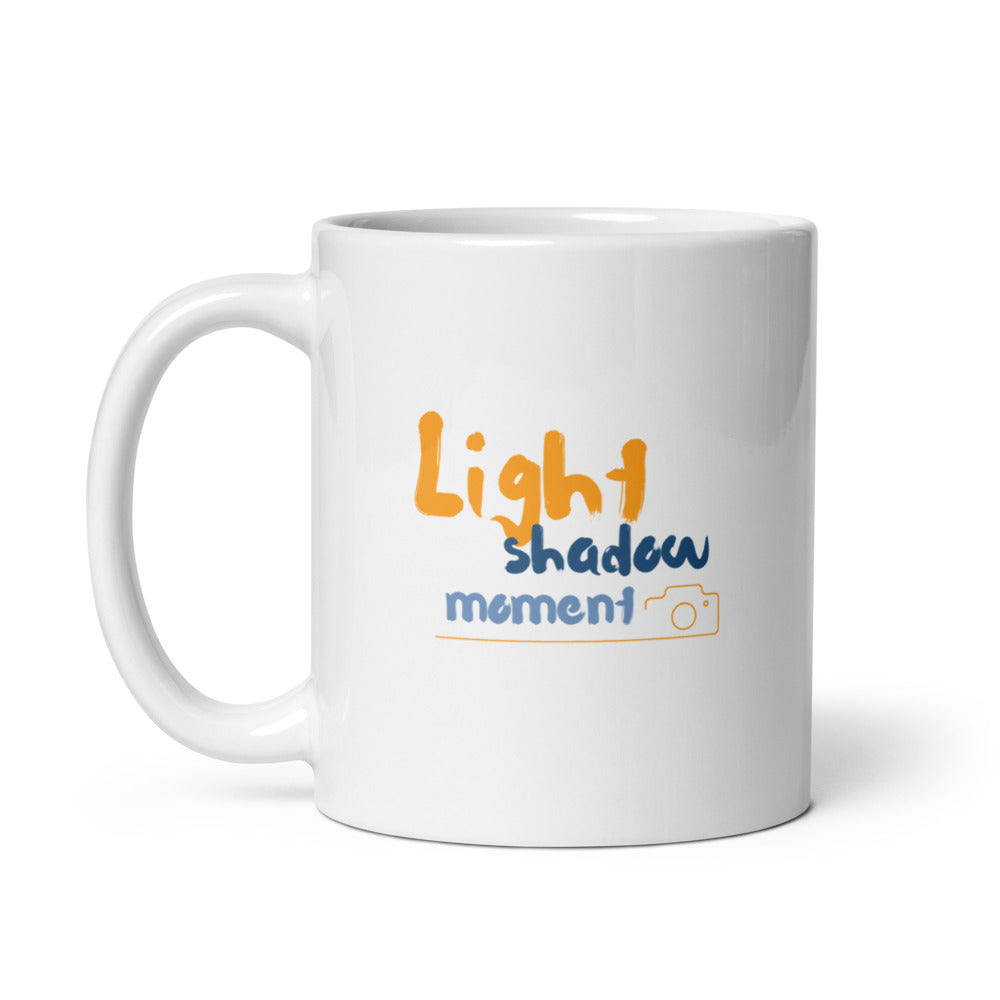 Colorful artistic camera mug with 'Light shadow moment' quote, a vibrant 11oz coffee cup gift for photographers and artists.