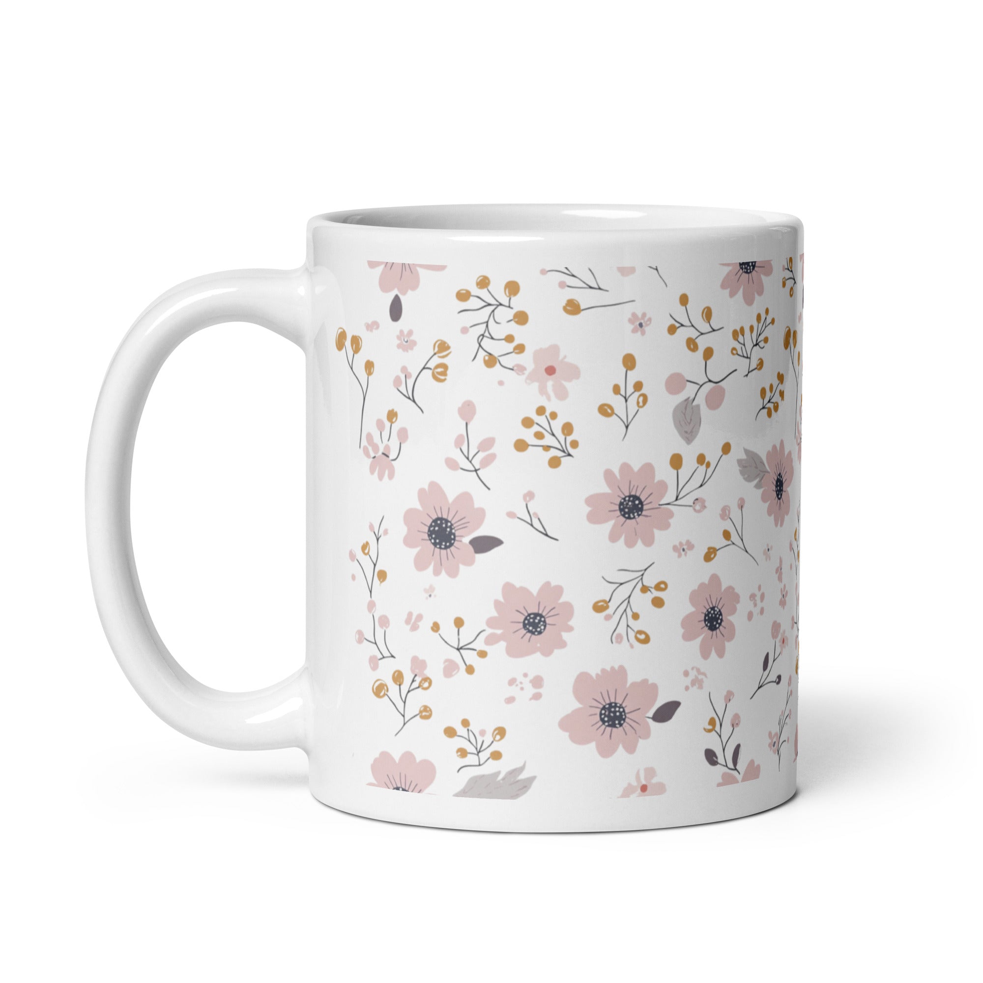 Two ceramic coffee mugs with a floral pattern, one with the handle up and the other with the handle down, on a white background.