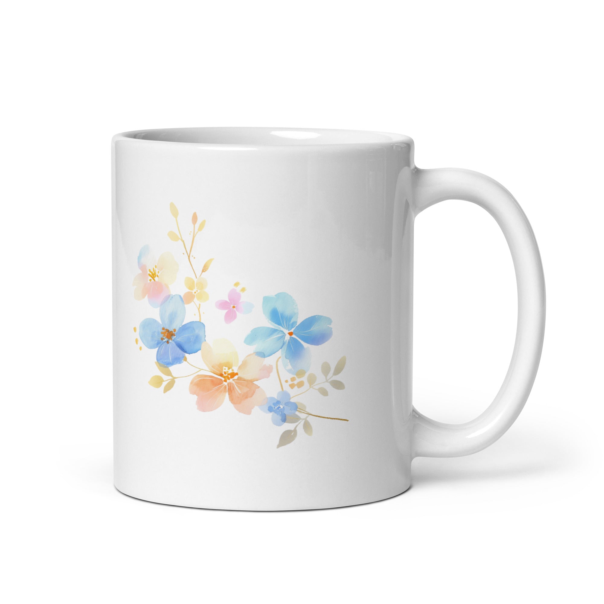 A set of two ceramic mugs, one with a floral watercolor design and the other with a 'Good Morning' message in white text on a blue background, both featuring a handle.