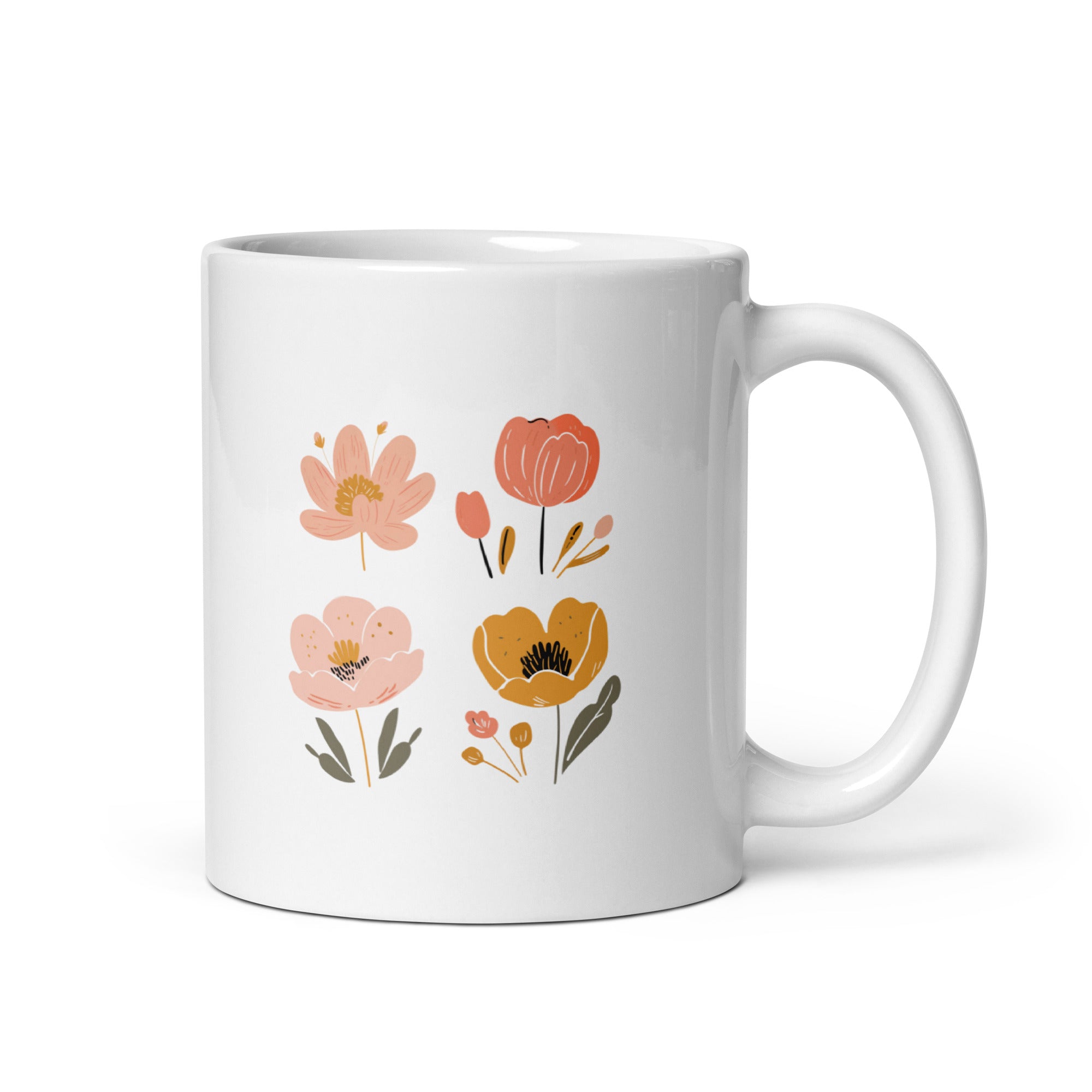 A set of two ceramic mugs, one with a floral design featuring various flowers in earthy tones and the other with a 'Good Morning' message in a golden background. Both mugs have handles and are shown with the inside of one mug facing the viewer.