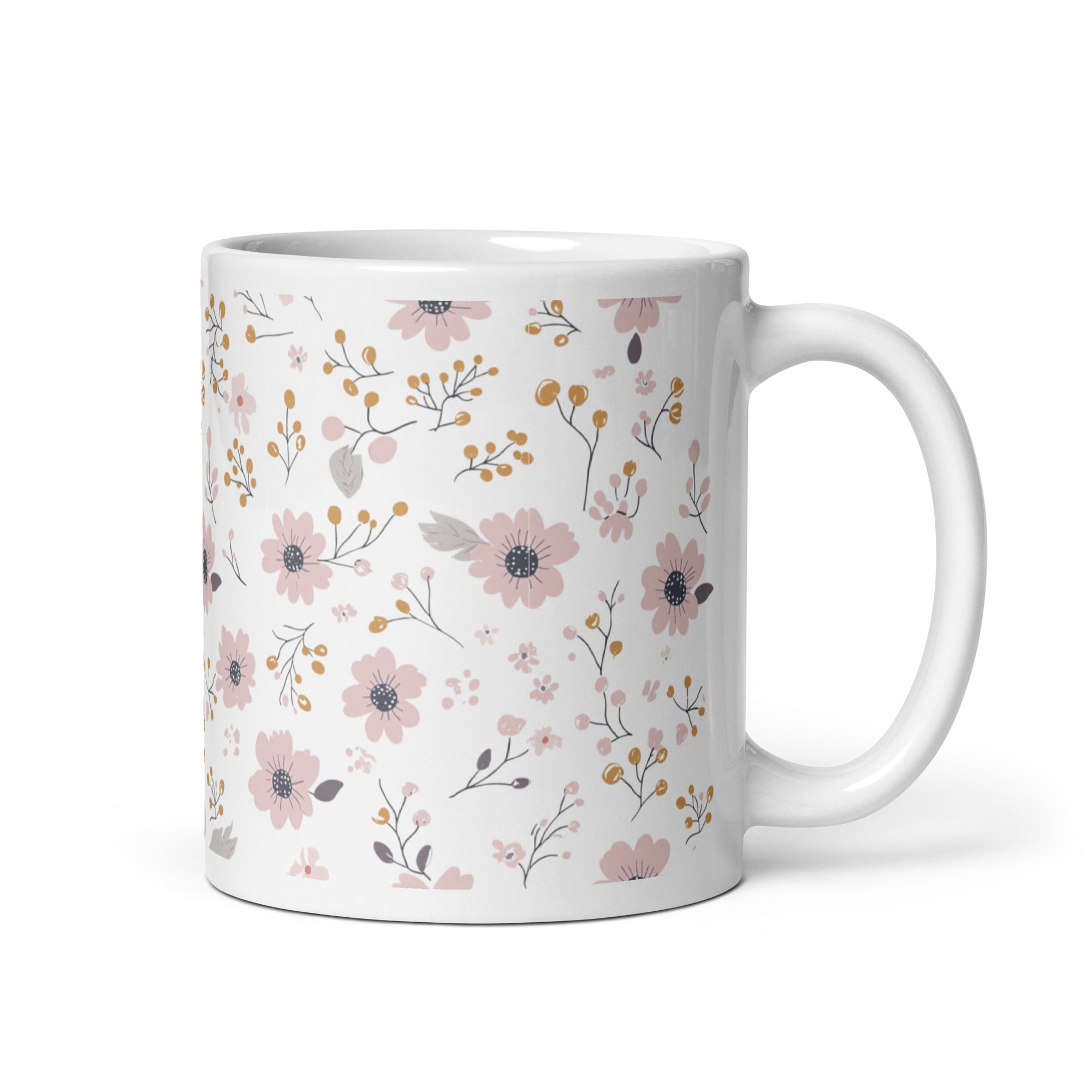 Two ceramic coffee mugs with a floral pattern, one with the handle up and the other with the handle down, on a white background.