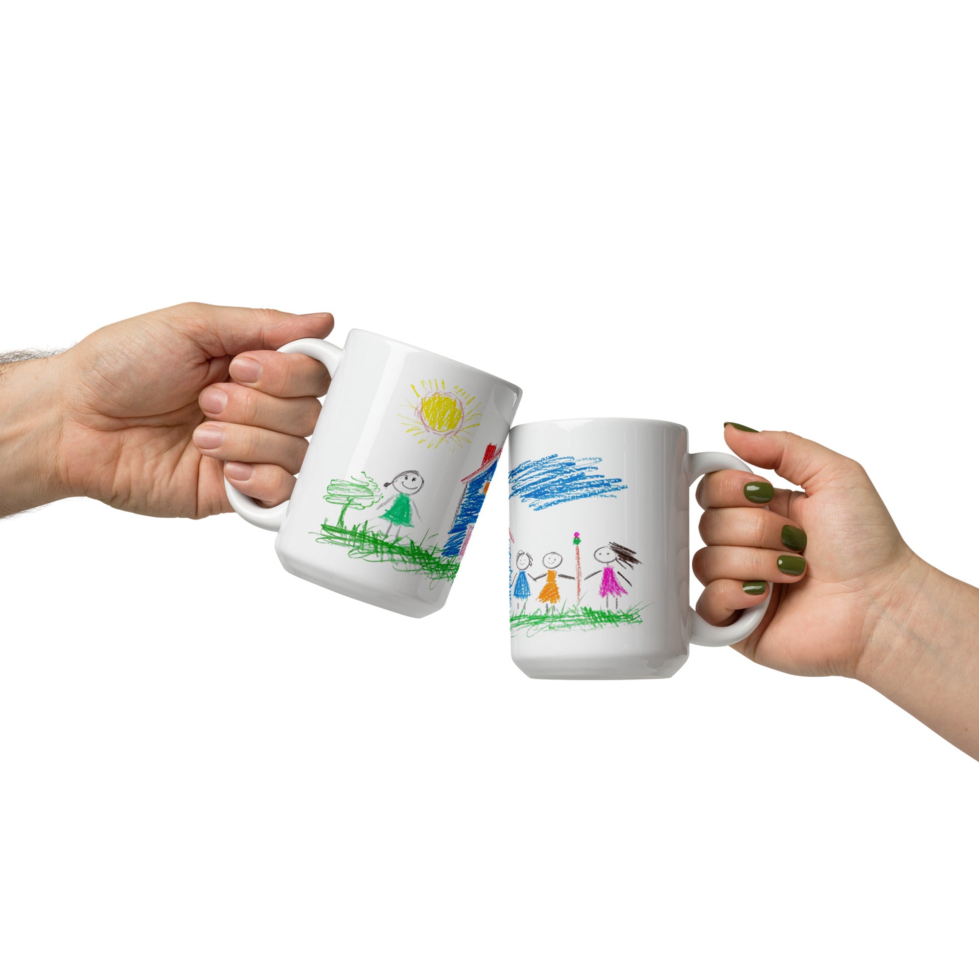 Two white ceramic mugs with colorful childlike drawings. One mug displays a house, sun, and a smiling family.